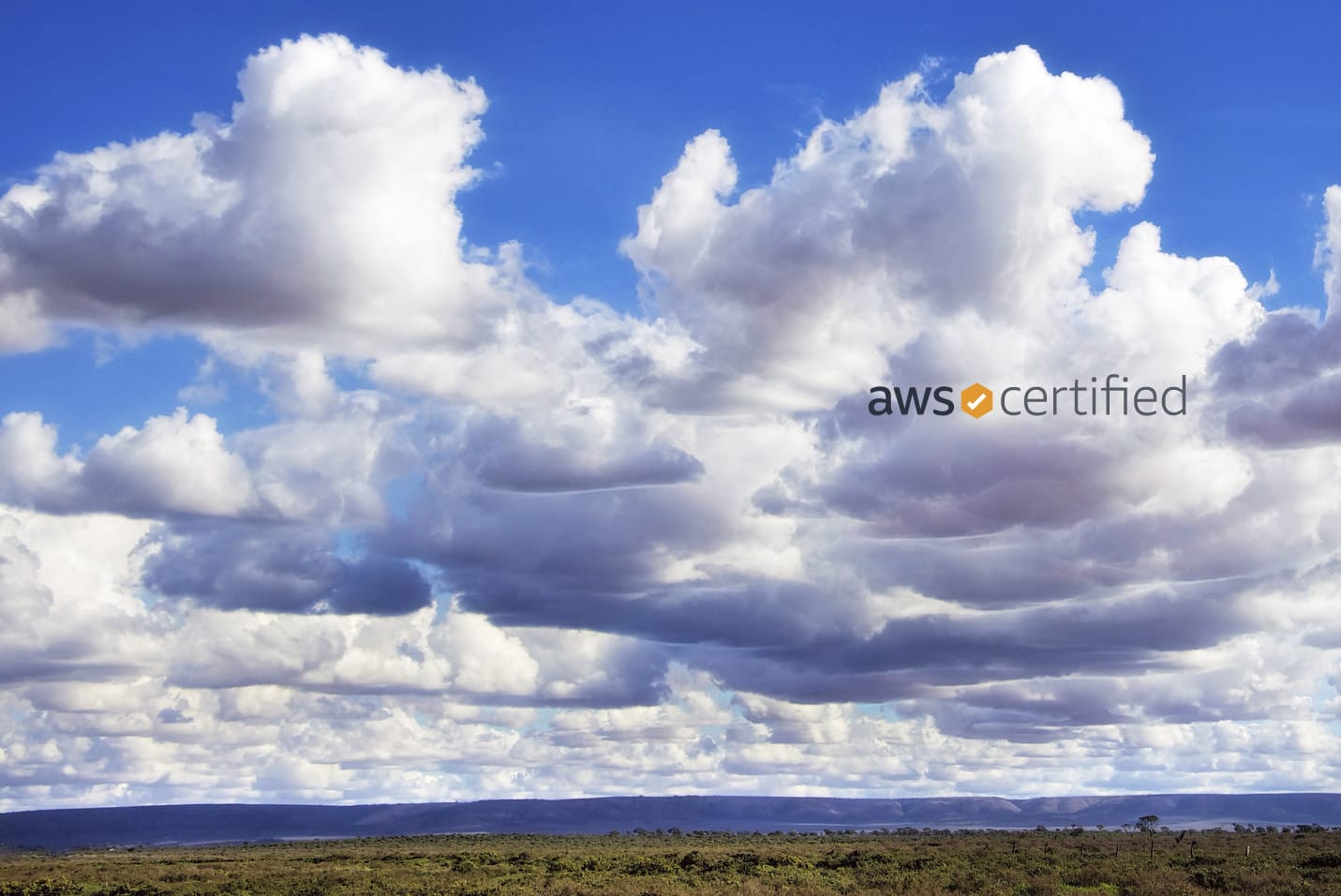 Picture of clouds with AWS Certified logo on top